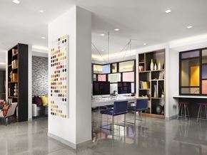 Worcester apartment for rent - A modern office space with a white column and a colorful artwork.