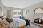 North Chesterfield apartment for rent - A bedroom with a large bed and a mirror on the wall.