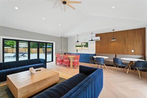 Chesterfield townhouse for rent - A modern living room with a dark blue sofa and wooden coffee table at The Lawton Townhomes, Virginia, 23832