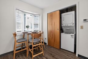 Brunswick apartment for rent - A small dining area with a table and chairs in front of a window.