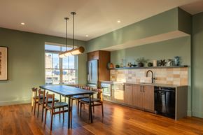 Manchester apartment for rent - A modern kitchen with a dining table and chairs.