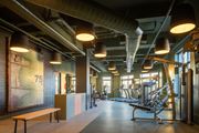 Manchester apartment for rent - A gym with a bench, weights, and exercise equipment.