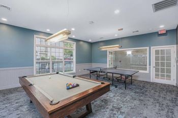 Game room with pool table & ping pong table