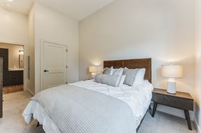 Manchester apartment for rent - a bedroom with a large bed and a closet