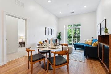 Manchester apartment for rent - an open living room with a dining room table and chairs
