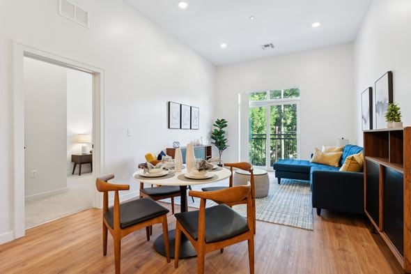 Manchester apartment for rent - an open living room with a dining room table and chairs
