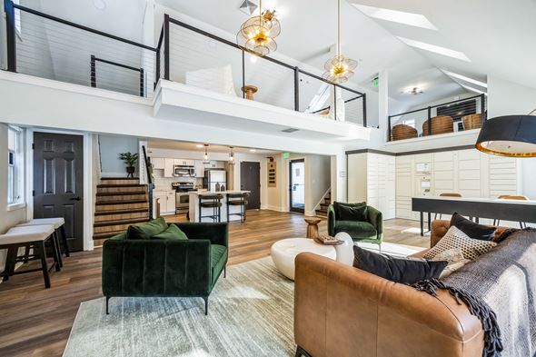 Chelmsford apartment for rent - A living room with a green couch and a brown leather chair.