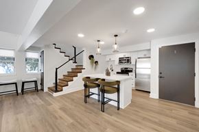 Chelmsford apartment for rent - A modern kitchen with a dining table and chairs.