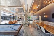 Glastonbury apartment for rent - a clubhouse with a pool table and a bar with chairs at The Tannery, Connecticut