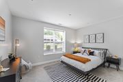 Glastonbury apartment for rent - A bedroom with a large bed and a desk.