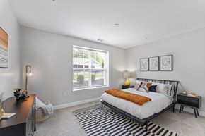 Glastonbury apartment for rent - A bedroom with a large bed and a desk.