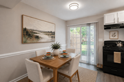 Chesterfield townhouse for rent - A dining room with a wooden table set for two.