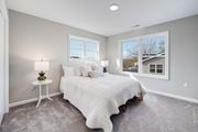 Griswold apartment for rent - a bedroom with a bed and two windows at Pleasant View Estates, Connecticut