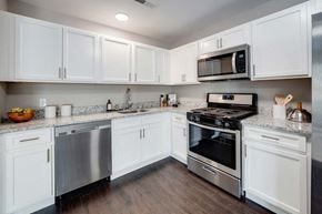 Griswold apartment for rent - a kitchen with stainless steel appliances and white cabinets at Pleasant View Estates, Griswold, 06351