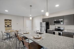 North Attleboro apartment for rent - A modern kitchen with granite countertops and stainless steel appliances.