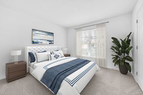 Hooksett apartment for rent - A bedroom with a large bed and a painting on the wall at Windsor Terrace, Hooksett, NH