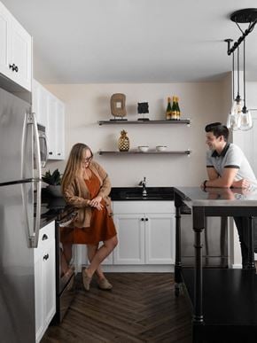 Detroit apartment for rent - a man and a woman standing in a kitchen