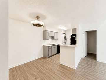 Scottsdale apartment for rent - A kitchen area with a sink and a refrigerator.