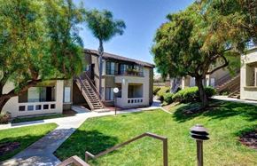 San Diego apartment for rent - the backyard of a house with a yard and trees