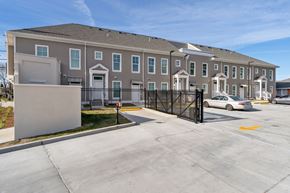 New Orleans apartment for rent - Grove Olace I large apartment building with a driveway and a parking lot