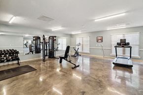 Hammond apartment for rent - the gym has plenty of exercise equipment and a large window