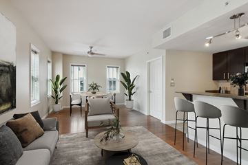 New Orleans apartment for rent - a living room with a couch and a table with chairs
