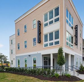 Lake Charles apartment for rent - A building with a sign that says "Mid City Lofts".