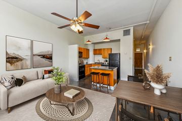 New Orleans apartment for rent - a living room with a couch and a table and a kitchen