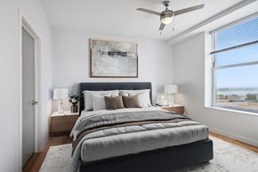 New Orleans apartment for rent - an image of a bedroom with a bed and a ceiling fan
