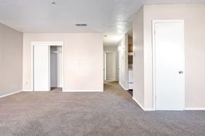 Harvey apartment for rent - A spacious room with carpeted floor and white walls.