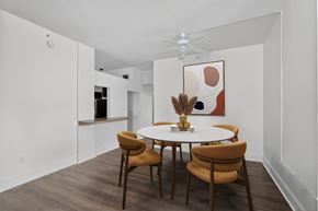 New Orleans apartment for rent - A white dining room with a round table and chairs.