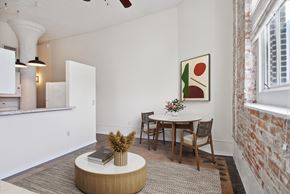 New Orleans apartment for rent - a dining room with a table and chairs and a window