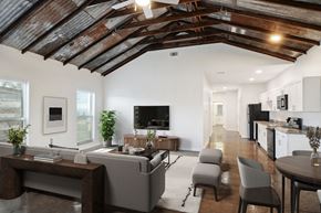 New Orleans apartment for rent - a living room with white walls and a ceiling with wooden beams