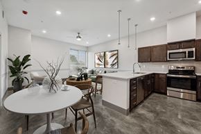 Lafayette apartment for rent - an open kitchen and dining room with a white table and chairs