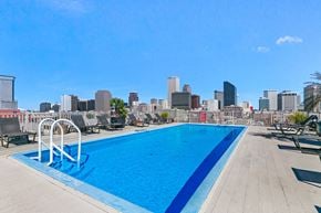 New Orleans apartment for rent - a swimming pool with a city skyline in the background