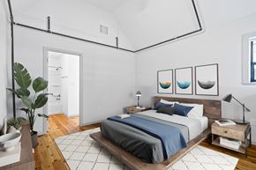 Shreveport apartment for rent - a bedroom with white walls and a bed with blue pillows