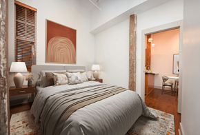 New Orleans apartment for rent - a bedroom with a bed and a door to a bathroom