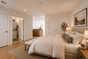 Richmond apartment for rent - A bedroom with a large bed and a painting on the wall.
