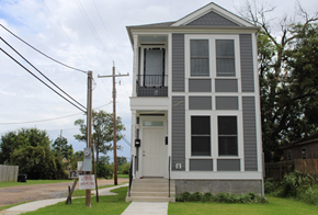 New Orleans apartment for rent - A grey house with a white door and windows.
