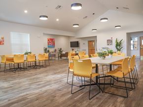Houma apartment for rent - a conference room with yellow chairs and a white table
