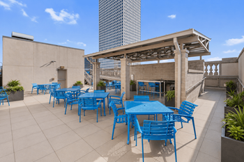 Rooftop dining and lounge areas with barbecue grilling stations