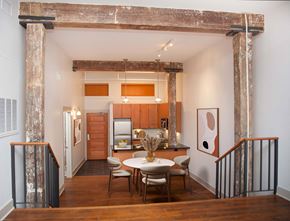New Orleans apartment for rent - a dining area with a table and chairs in a room with a kitchen