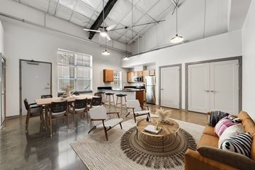 Lafayette apartment for rent - an open living room and kitchen with a table and chairs