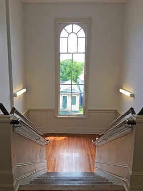 New Orleans apartment for rent - A staircase with a window above it.