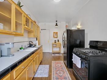 Kitchen with black refrigerator