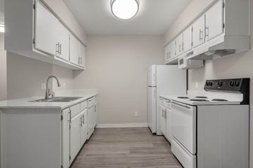 Lancaster apartment for rent - a white kitchen with white appliances and white cabinets