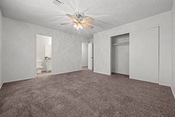 Lancaster townhouse for rent - a living room with carpet and a ceiling fan