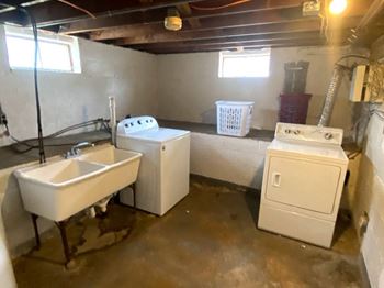 Coin-operated laundry facility in the basement of each building