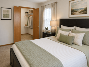 Findlay apartment for rent - A bedroom with a large bed and a painting on the wall.