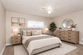 Hilliard townhouse for rent - A bedroom with a bed, nightstands, and a plant.